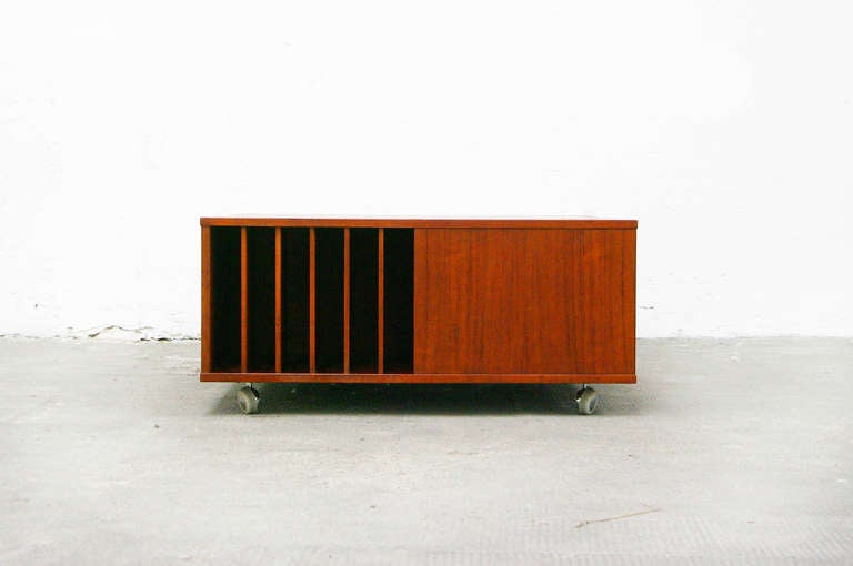 A striking cubus teak coffee table designed by Peter Løvig Nielsen.
The table has a large square surface.
On each side you may found a lot of storage options.
An adorable piece that would be an enrichment in any modern environment.