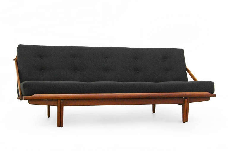 A Poul Volther teak and oak Daybed for FDB.
Functionality is the main theme with this piece. It can be simply be used as a sofa, or fold it up to bed.
Made of solid teak and oak under construction, which is of high quality.
The fabric is newly