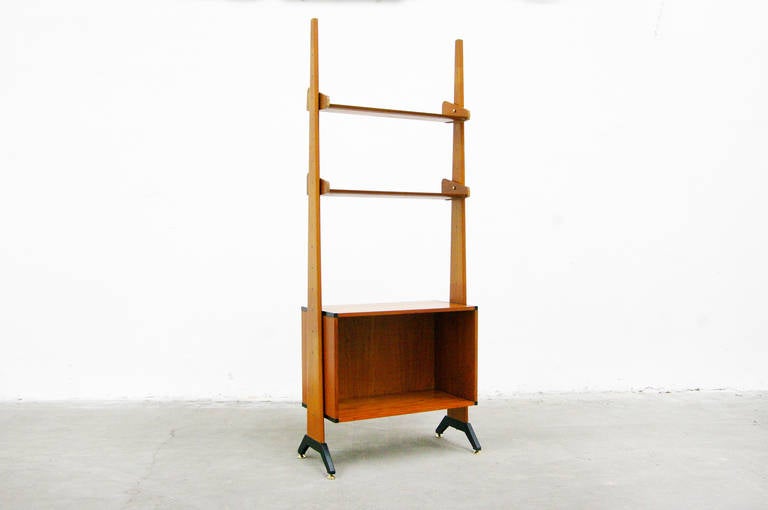 An adorable teakwood bookcase unit designed in the 1950s.
This set includes two wall panels and one cabinet.
Various marks and dents consistent with age and use.
This would be a beautiful choice for your modern environment.