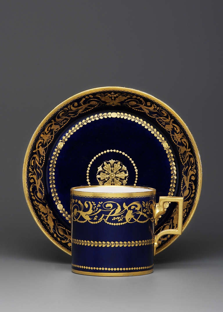 Very elegant cup and saucer with Leithnerblau ground (this very unique kind of color is called after the chemist - Joseph Leithner - working at the manufactory; he not only invented the most beautiful colors of the Sorgenthal era but also the famous