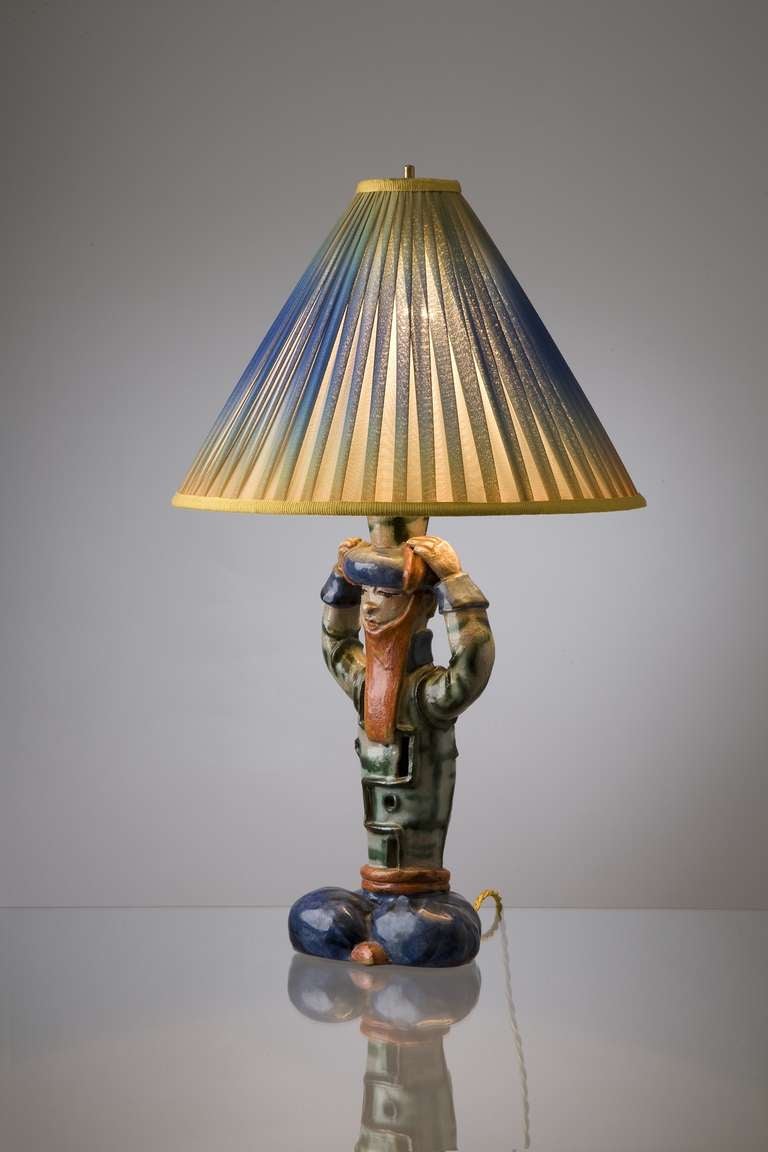 This exeptional table lamp, an oriental woman, is an example of expressive ceramics of daily use designed by the artists of the ceramics production of the 'Wiener Werkstaette'. Mainly women worked in this successful department of the Wiener