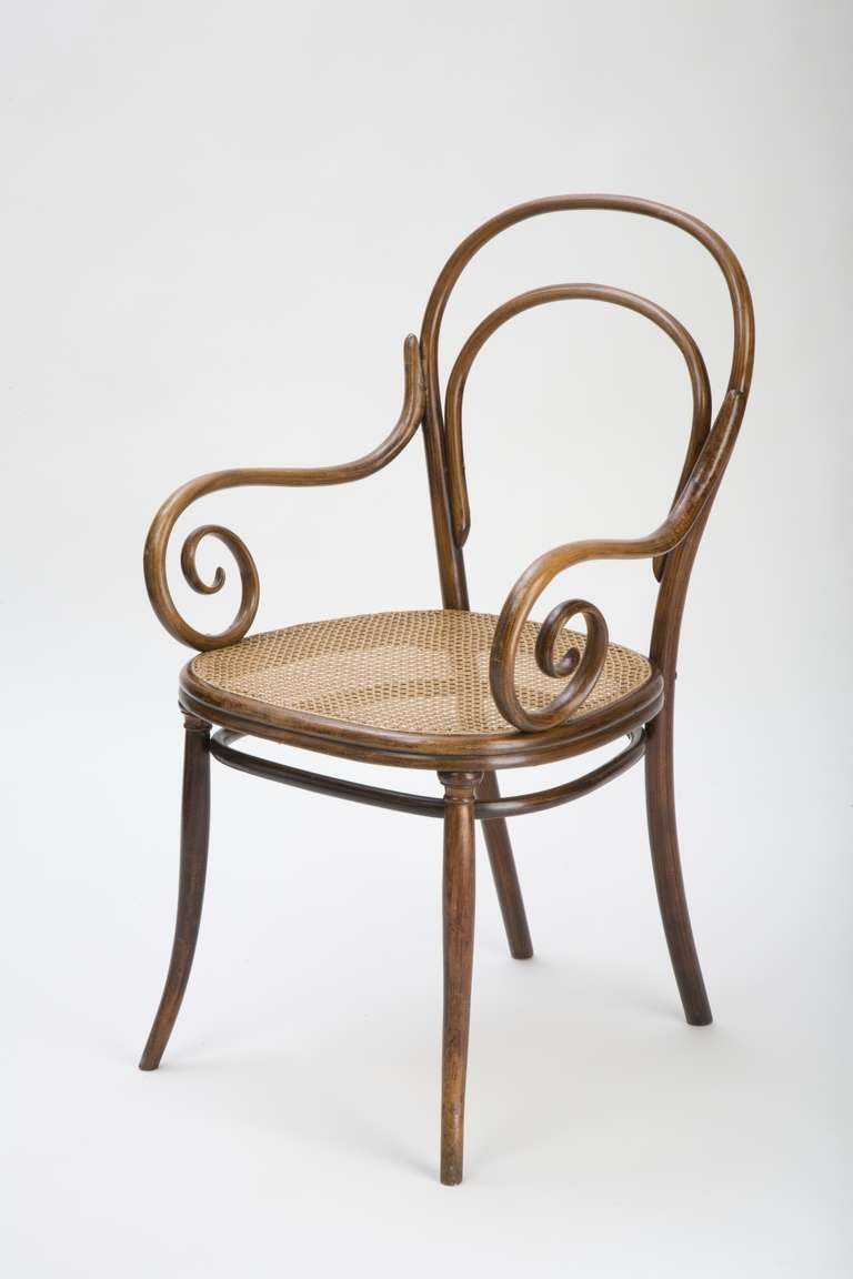 This type,designed by Thonet ca. 1855, was the predecessor of armchair  No. 14, that became one of the most produced bentwood chairs. The design resembles a biedermeier chair and transfers function and aesthetics into bentwood furniture. 
Original