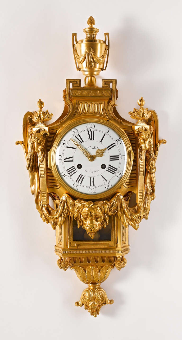 A fine French Louis XVI ormolu Cartel clock. The circular white enamel Roman and Arabic dial signed Nicolet Au Louvre (took over the workshop from C.S. Passement in 1774), with finely pierced and engraved gilt hands, the wasted case modelled with