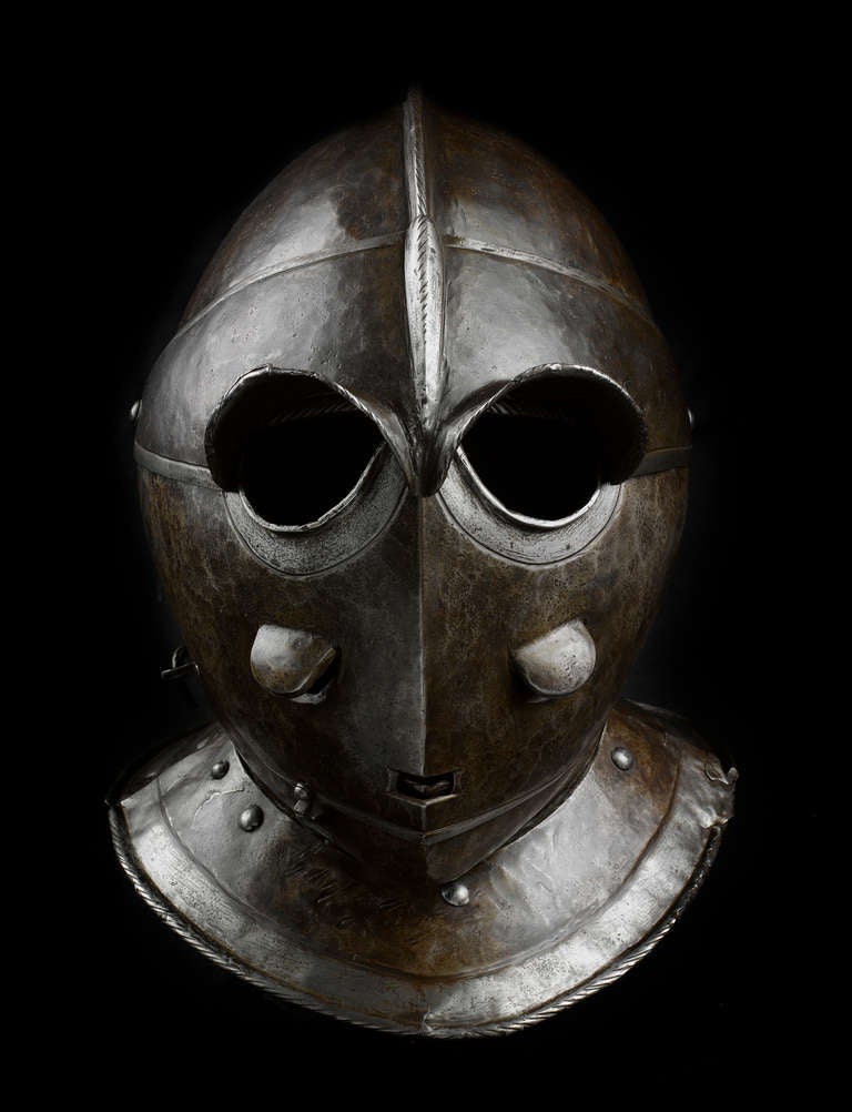 Also: Todenkopf, death's face or cat faced helmet.
Weight: 4.6 kg.

Provenance and literature:

I. Probably collection Baron Peuker, Berlin, sold at auction in Bruxelles: Le Roy, M. Henri
(1854): Catalogue Illustré D’Armes Anciennes