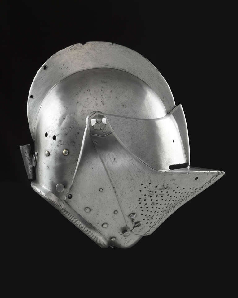 One piece skull with a high comb; bevor, upper bevor and visor; original fixing screws with hexagonal nuts and rivets for the securing of a lining, abrased on the edge of the skull; sprung and peg at the right side of the neck to close bevor and