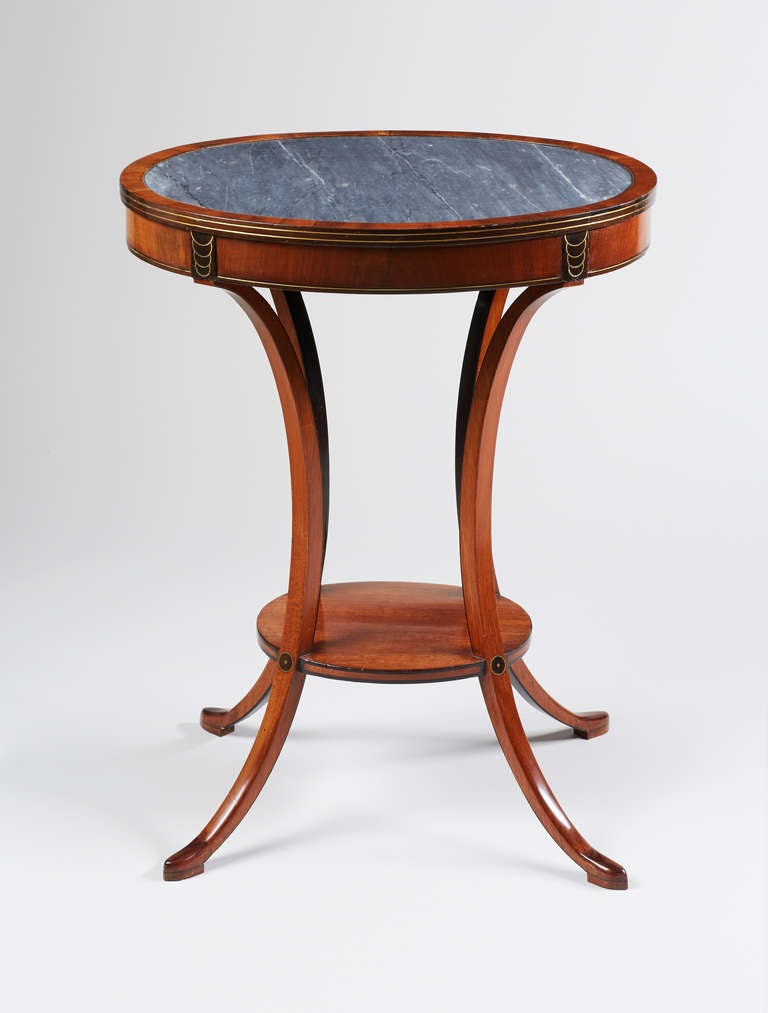 The oval grey marble insert top above a single frieze drawer, with brass line inlay, raised on slender curved legs joined by an oval undertier, ending on slipper feet; stamped Chapuis twice to the drawer interior, for Jean-Joseph Chapuis (1765-1864