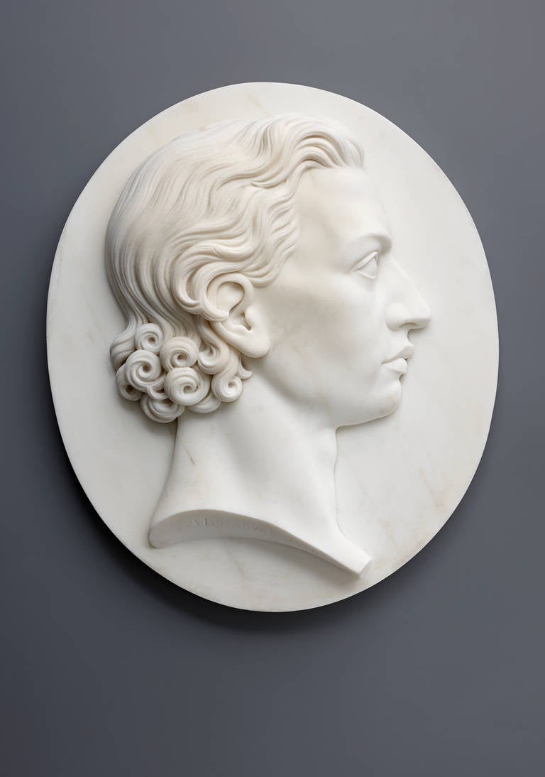 An idealized portrait of the young Friedrich von Schiller. The poet's likeness finely carved in relief of white marble and seen in profile from the right, signed at the truncated neck A. Lossow, fec. 1853. The German sculptor Arnold Hermann Lossow