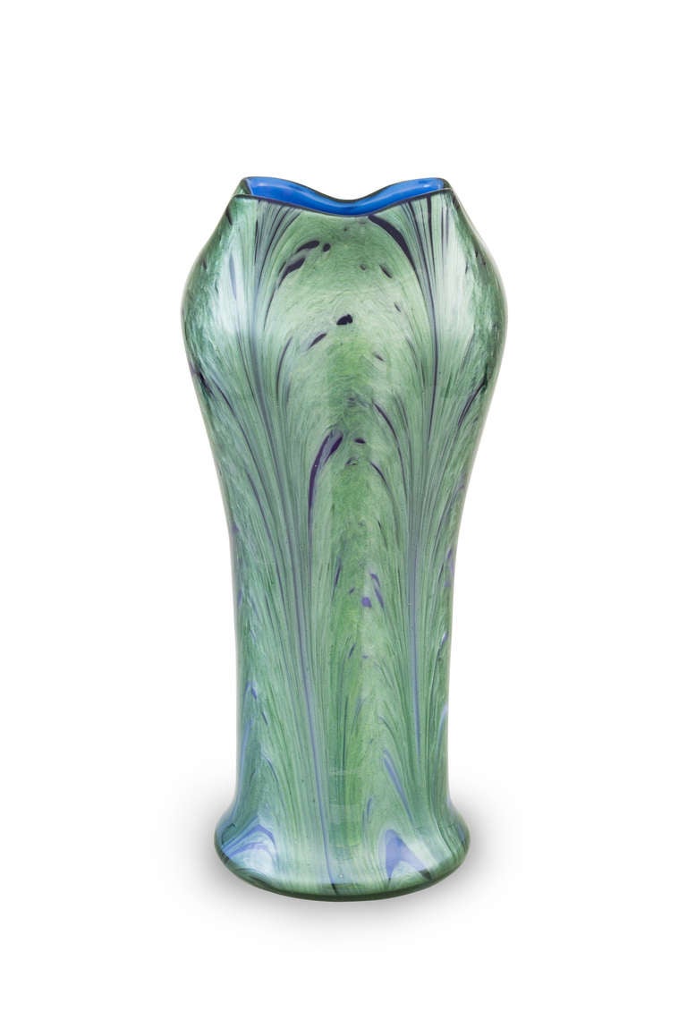 The most outstanding fact about this vase is the highly complex creation process. A four time glass overlay mixed with artistic designed decoration elements lends this vase an amazing, clear elegance. Another interesting fact is the art historical
