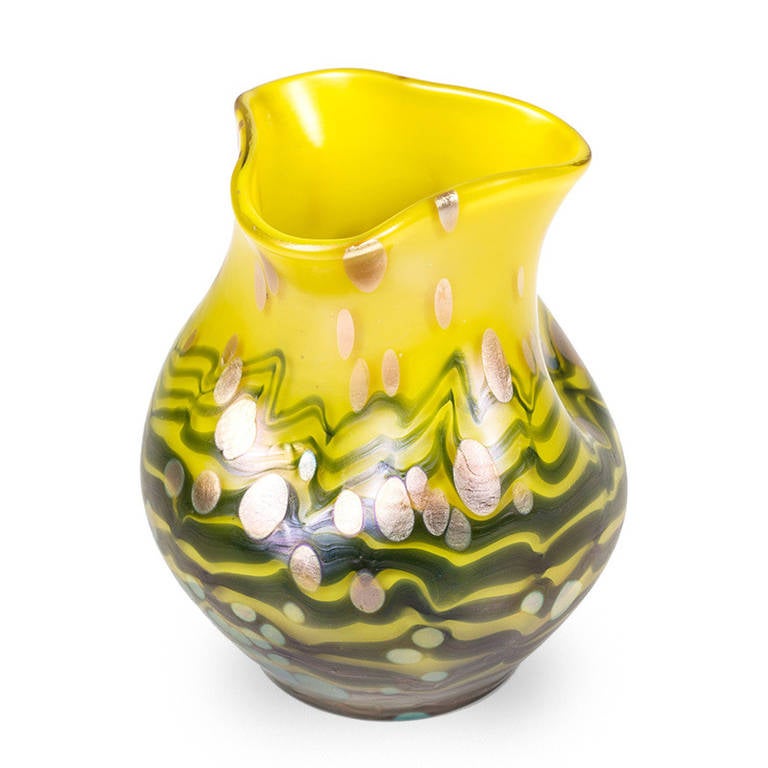 The Cytisus decoration, also called, goldrain, is among the most beautiful decorations ever created by the glassworks Johann Loetz-Witwe Klostermuehle. The decorations of Loetz often follow the dominating artistic taste and so does the Cytisus