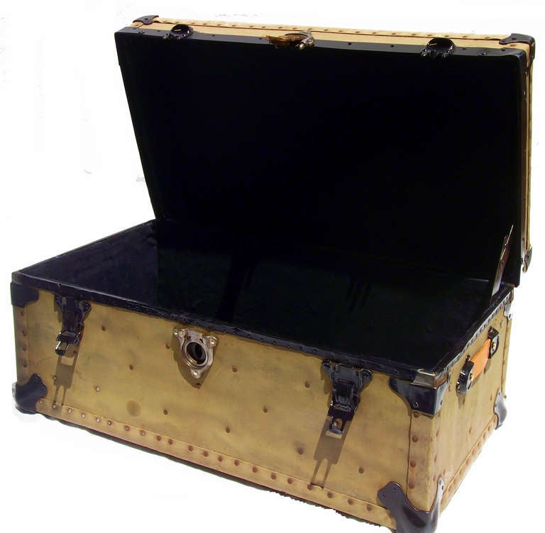 Army style footlocker C. 1915.  All original with solid brass lock and embossed brass logo plate on top upper lid.  Lined in black velvet cotton.