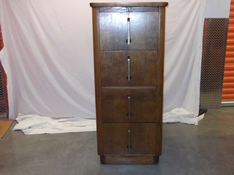 Solid oak, brass handles, locking custom made Abbess file cabinet.