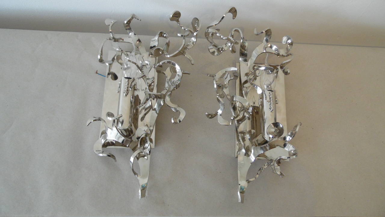 Pair of handcrafted nickel-plated wall sconces by William Brand and Annet Van Egmond. Award winning artists with very unique handcrafted works. Very high quality.
