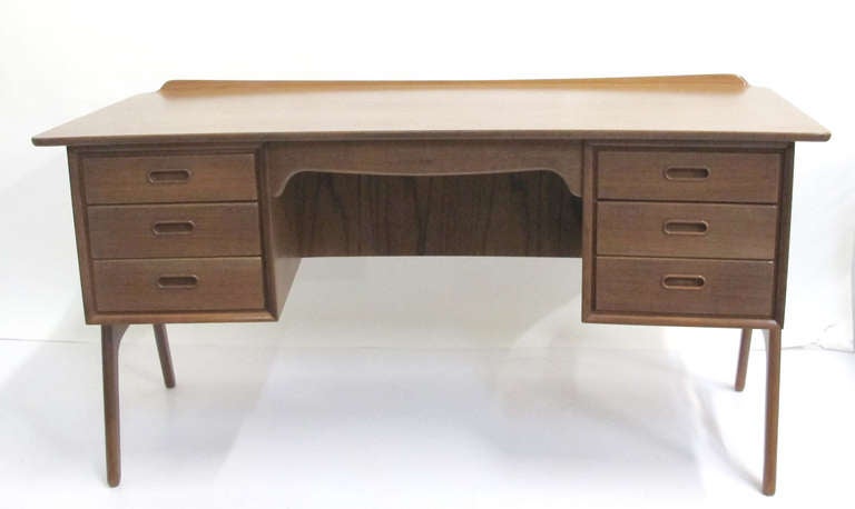 Teak desk with 6 drawers and shelf on front. Nice large desk by by Svend aageMadsen