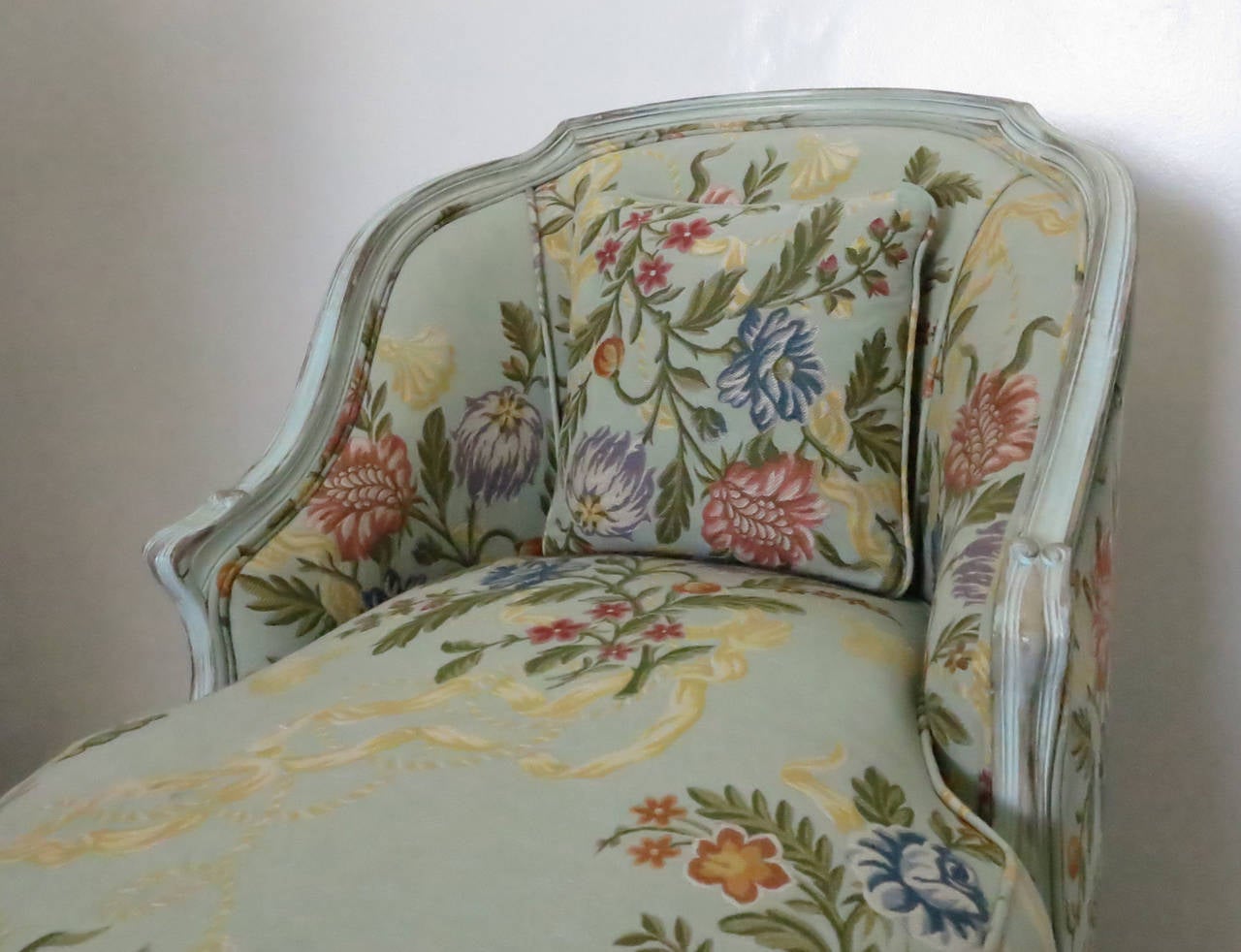 Recently reupholstered in an attractive floral fabric. Distressed finish on the frame. Very comfortable and ready to use.