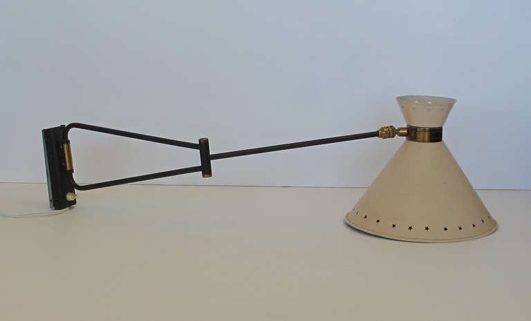 French Wall light, circa  1950s wall sconce with star perforated tole shade.