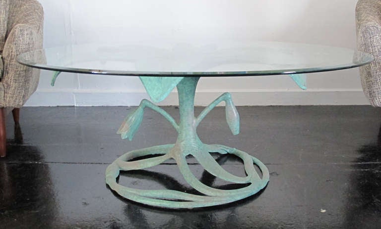 Arthur Court Aluminum Flower Table with verdigris color  finish. Glass top has 44 1/2 inch diameter