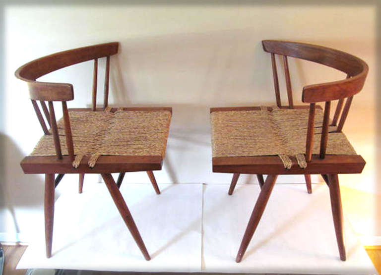 Two George Nakashima walnut grass seat dining chairs