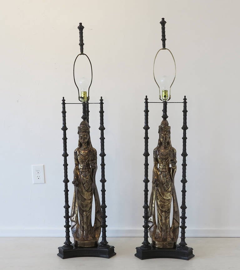 Beautifully designed pair of wood and d'ore bronze figural table lamps in the style of James Mont. These very tall (55