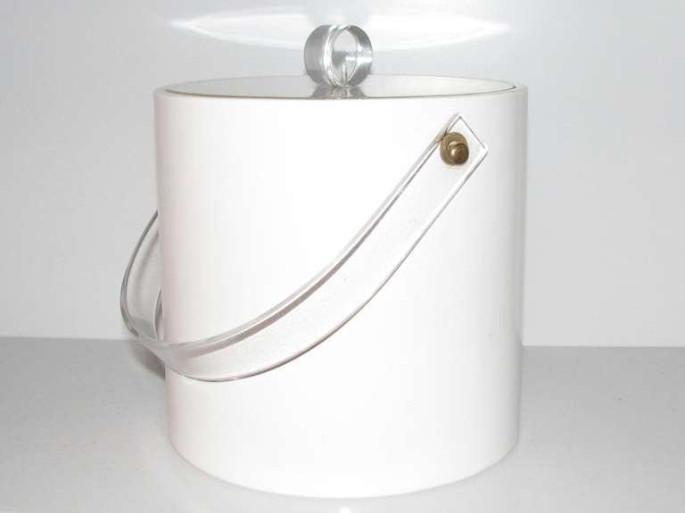 White vinyl ice bucket with lucite top and handle.