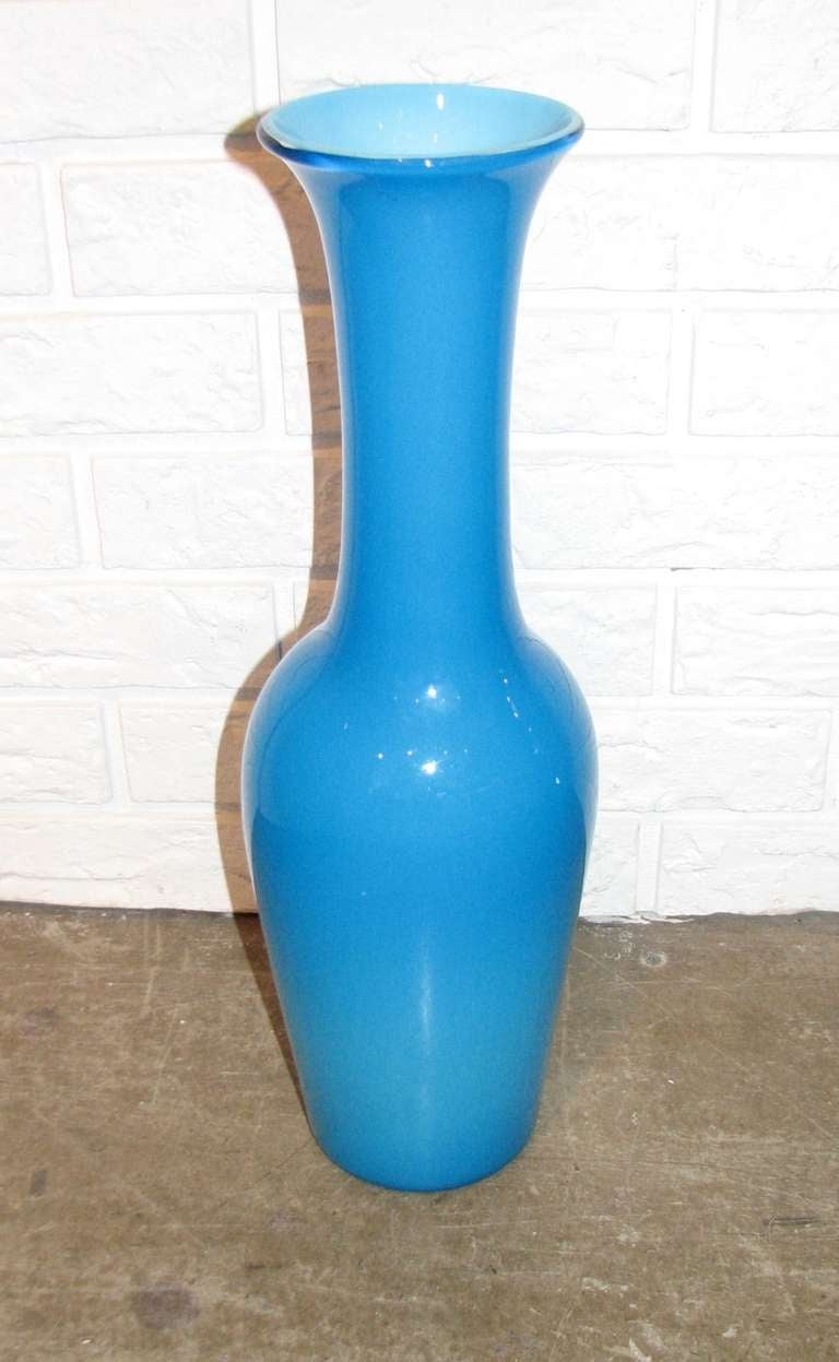 Tall blue case glass vase.