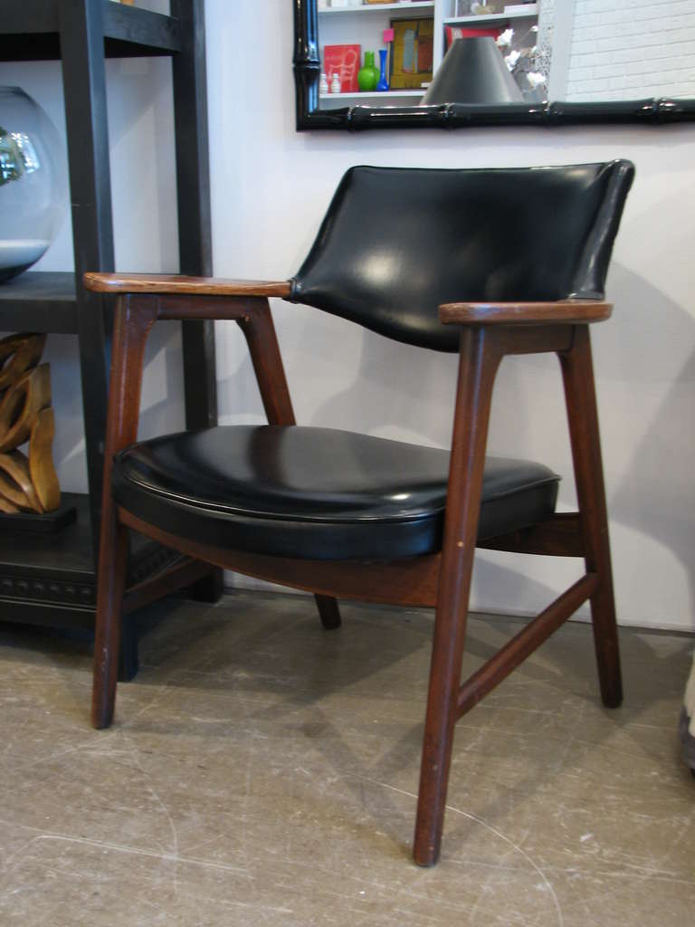 Pair of black vinyl and walnut chairs by Paoli Chair Co