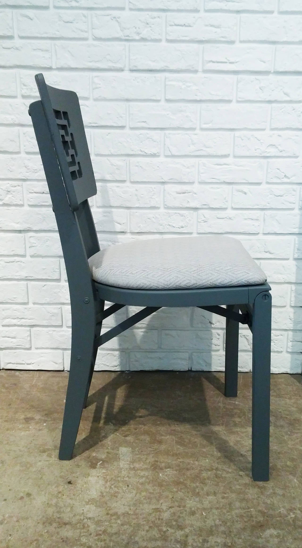 Set of six grey Chinese modern folding chairs with newly upholstered seats.