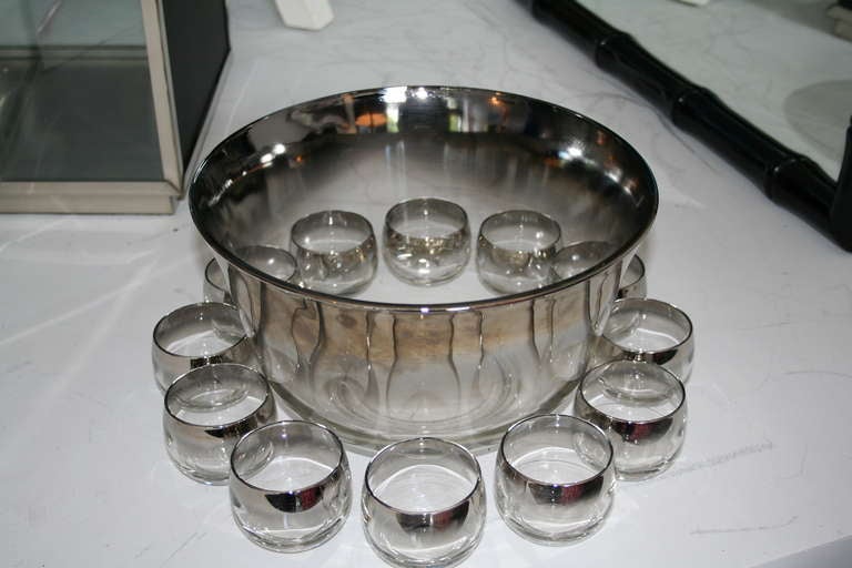 Dorothy Thorpe punch bowl with 12 cups. Silver rims are in just out of the box condition.