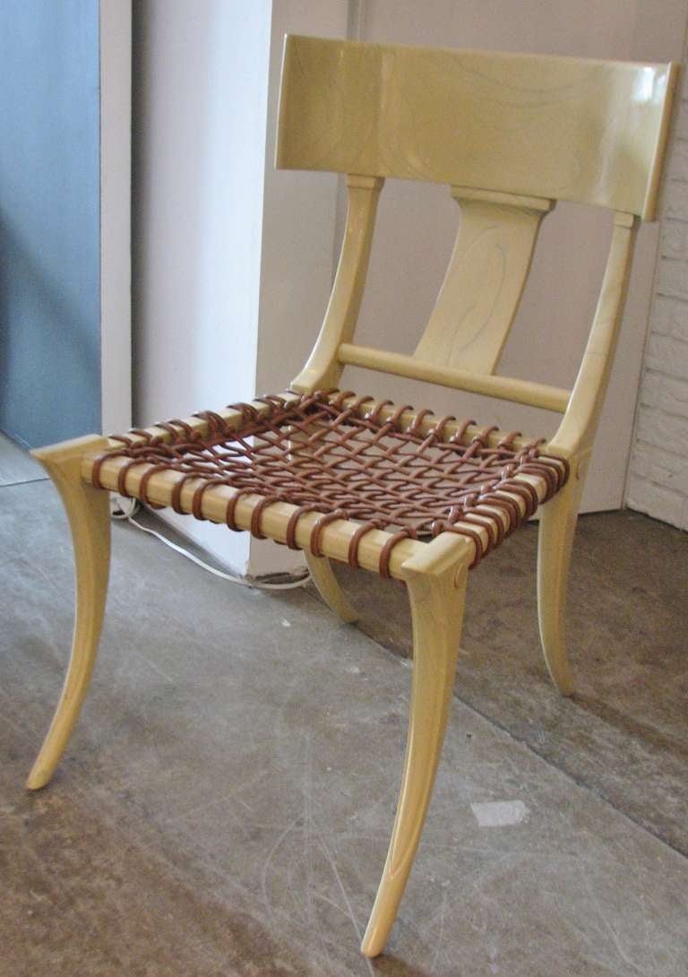 T. H. Robsjohn-Gibbings inspired limed/cerused oak Klismos chairs with leather striped seats. There are four available and the price is per chair. These are in excellent shape with no breaks, chips or wear.