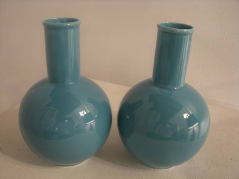 Pair of turquoise ceramic vases.