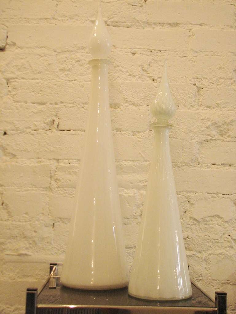 Pair of 1950's white glass vases with stoppers. Tall one is 25