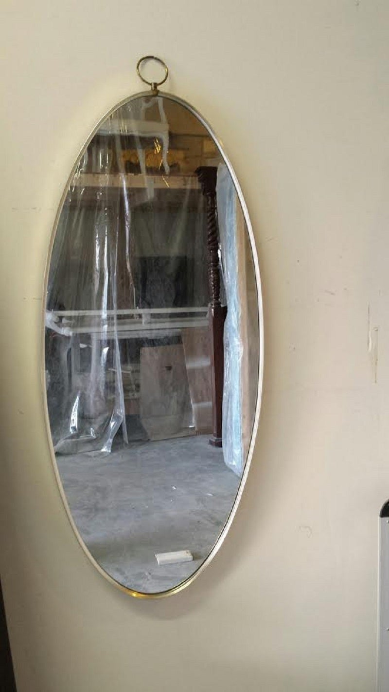 A fine mid century oval wall mirror.