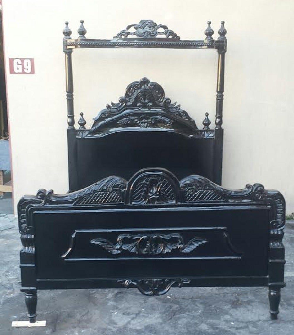 A French Louis XV / Gothic style bed. Finished in black. Solid wood with beautiful carvings. Will fit a standard Queen size mattress. 

The total height of the headboard with canopy is: 80
