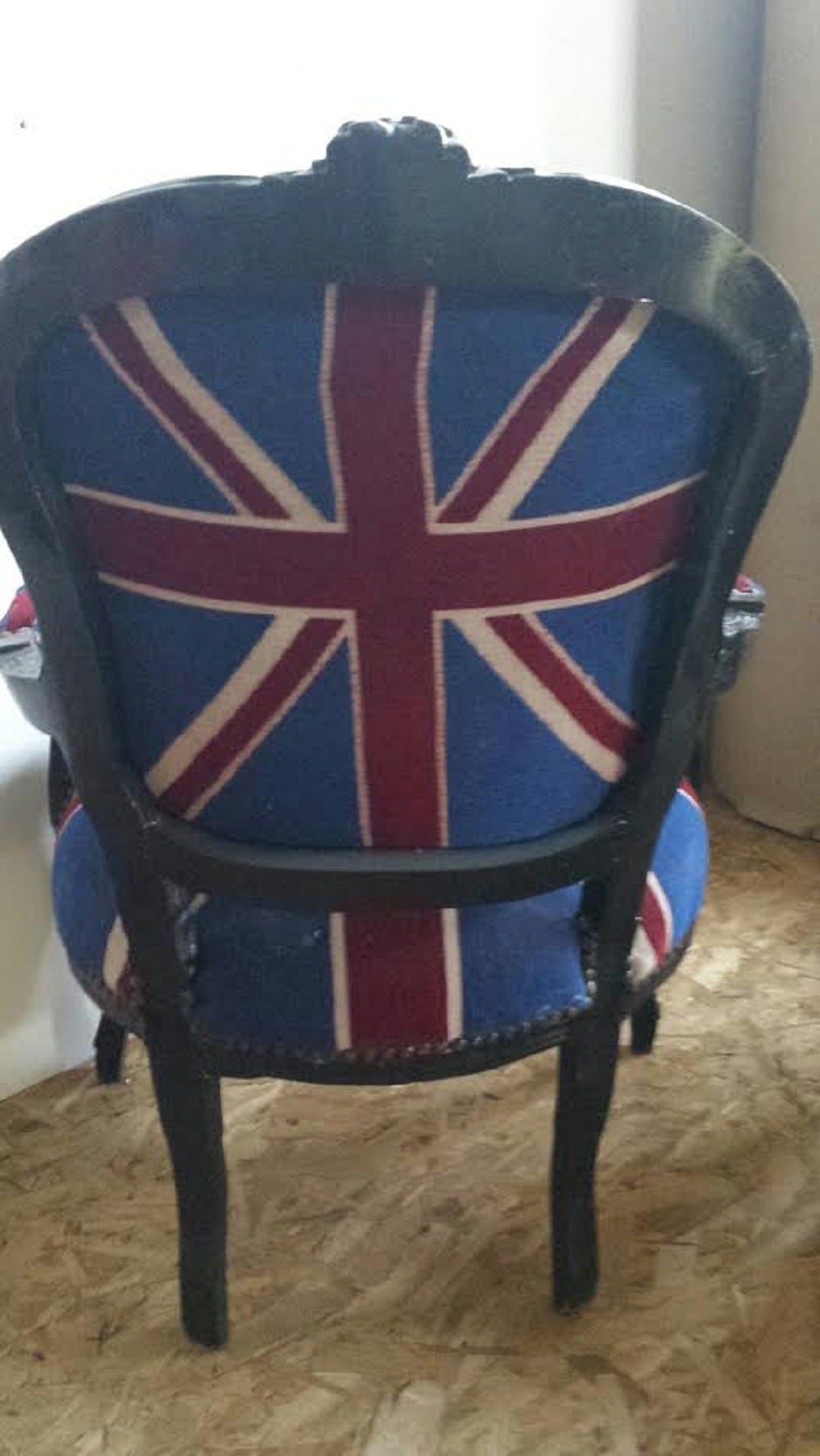 Beautiful armchair in the English flag. Wooden frame painted in black. Newly upholstered in union jack fabric. Nailheads trim.