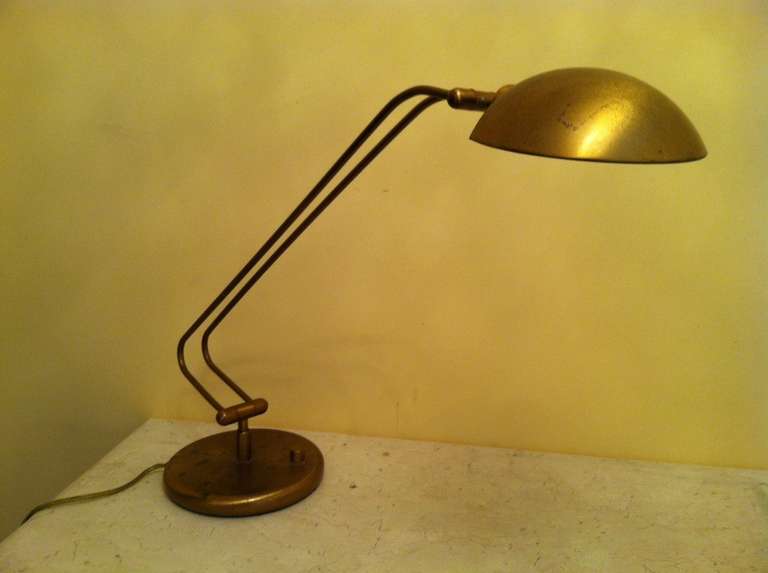 Antique brass finish desk or table lamp. Four swivel positions, turn knob with dimmer. With halogen light up to 100 W.