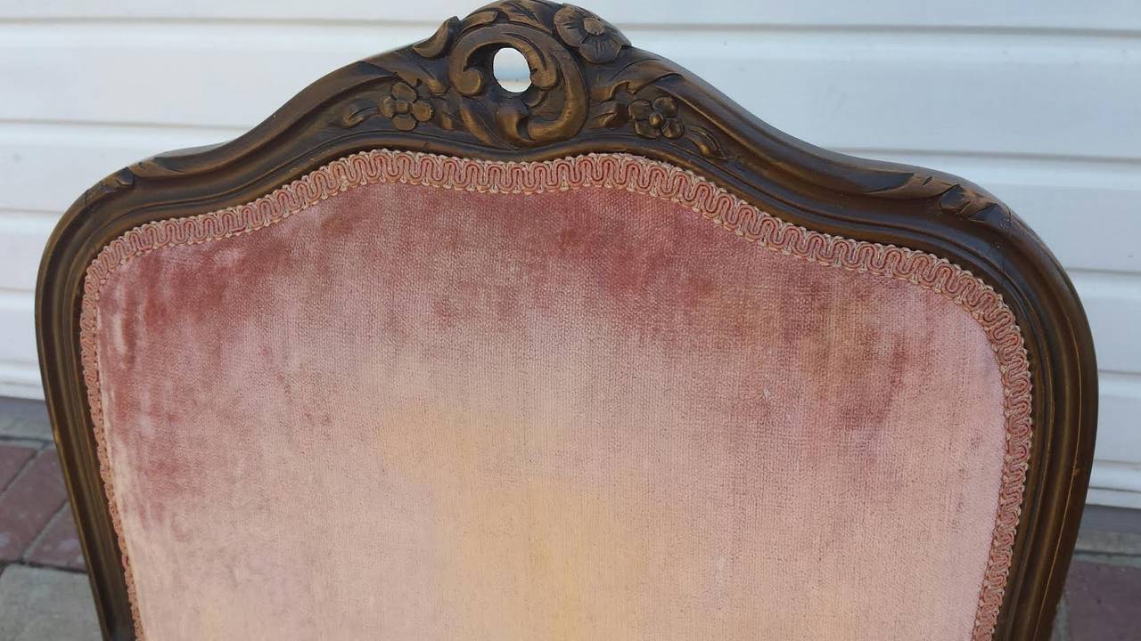 French Louis Xv style armchair. In original condition. Upholstered in coral color velvet fabric with wear shown on the fabric due to age and use.