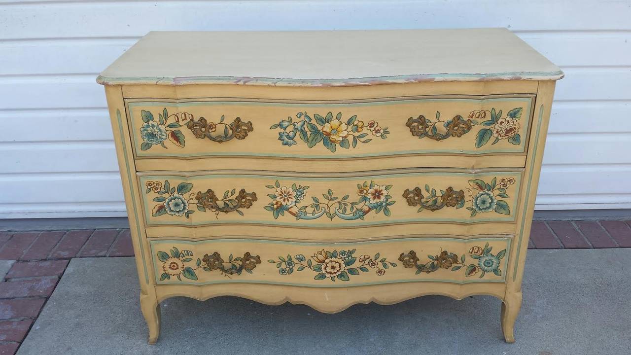 Floral Painted Chest of Drawers by John Widdicomb. Three drawers for storage with beautiful hardware. The chest is in original condition.
