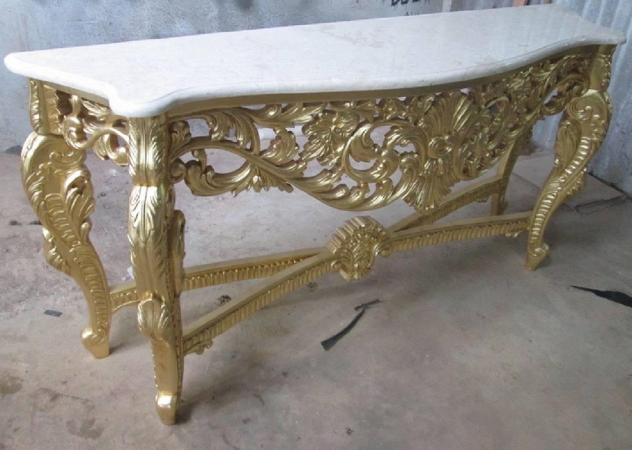 Beautiful French Louis XV Rococo style console table. Gold leaf finish on the wood. White marble top.