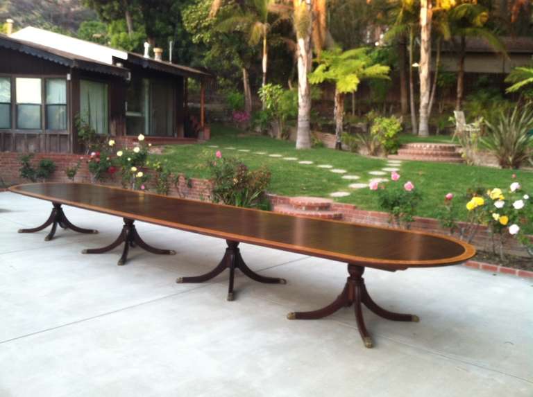 Massive English Dining Table 21ft long.  Made by Gostin in United Kingdom. The table comes with three tops. Table sold 