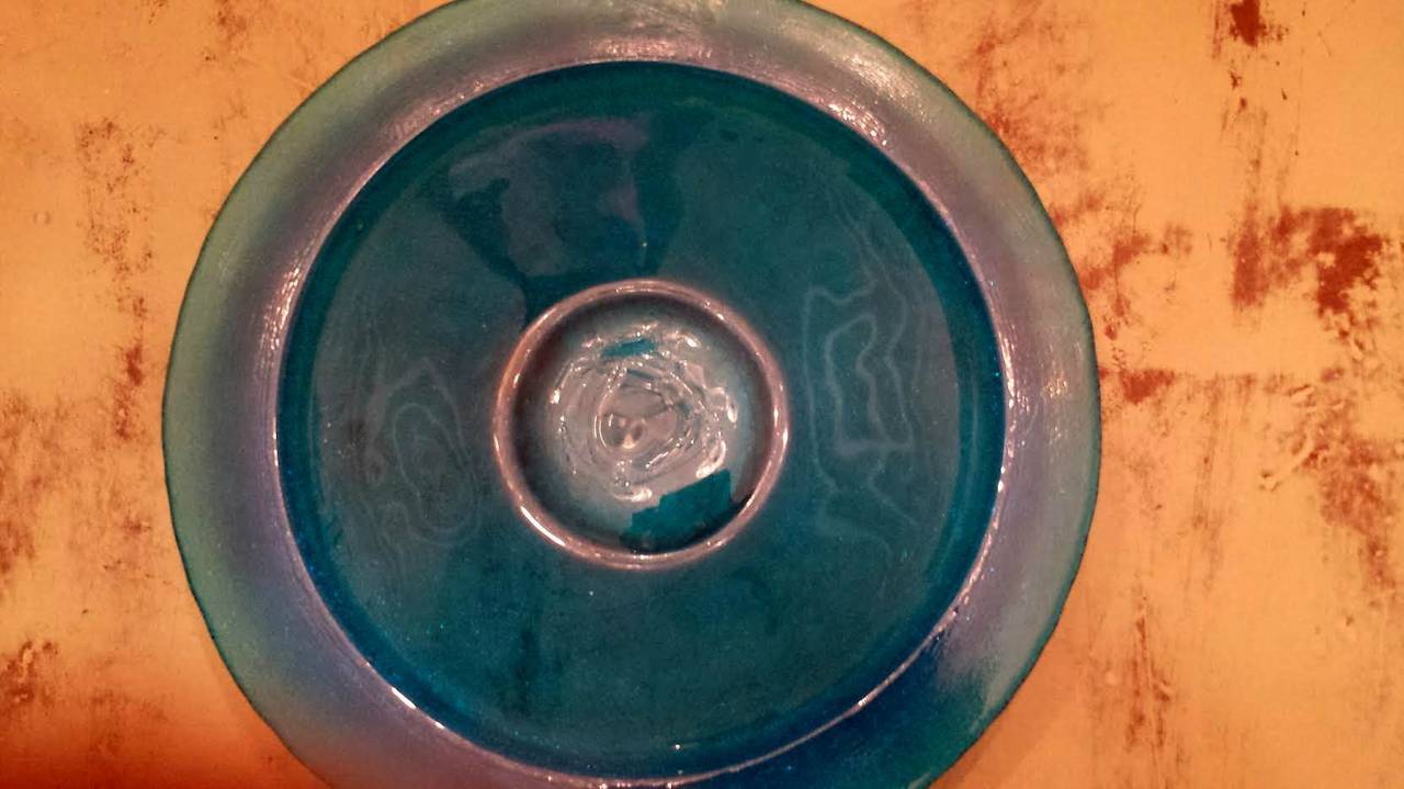 A large vintage glass bowl.