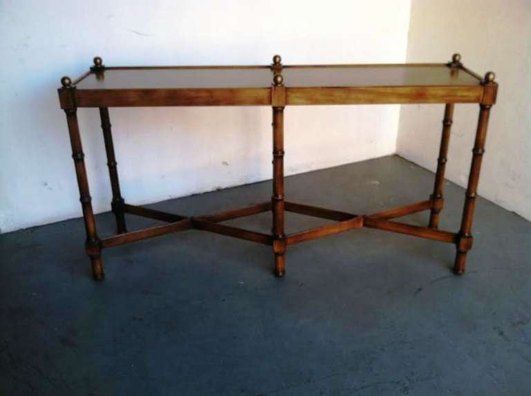 Classic Console Table made by Brandt.
Faux bamboo stretchers and legs, Walnut wood.