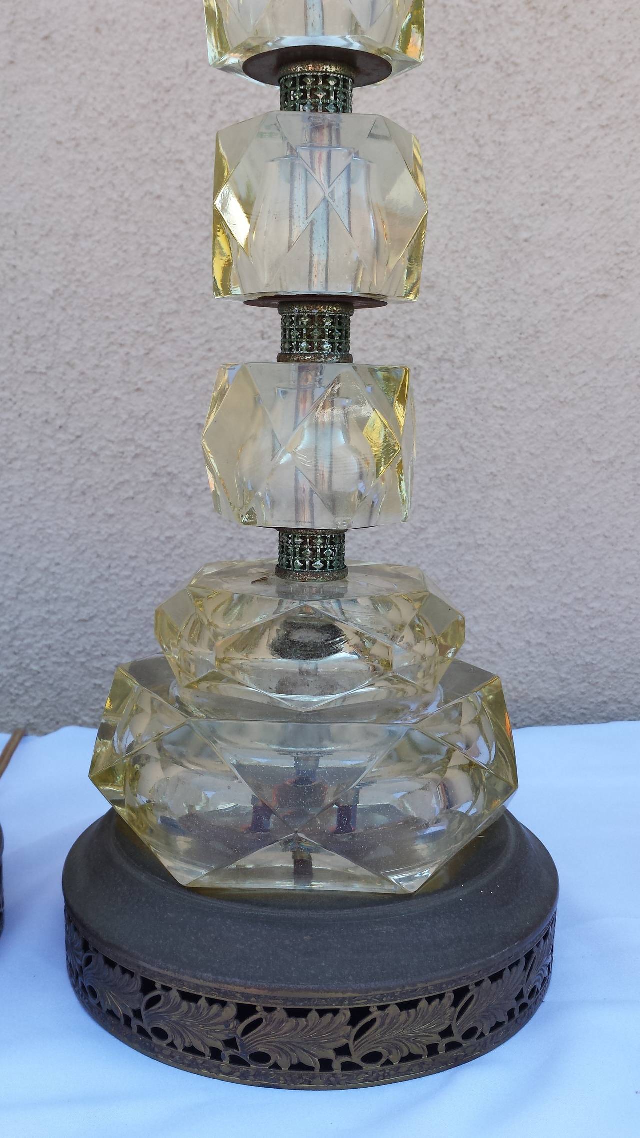 Beautiful pair of glass cut lamps. Big chunks of glass. The lamps are heavy and well crafted. With original adjustable harps.
