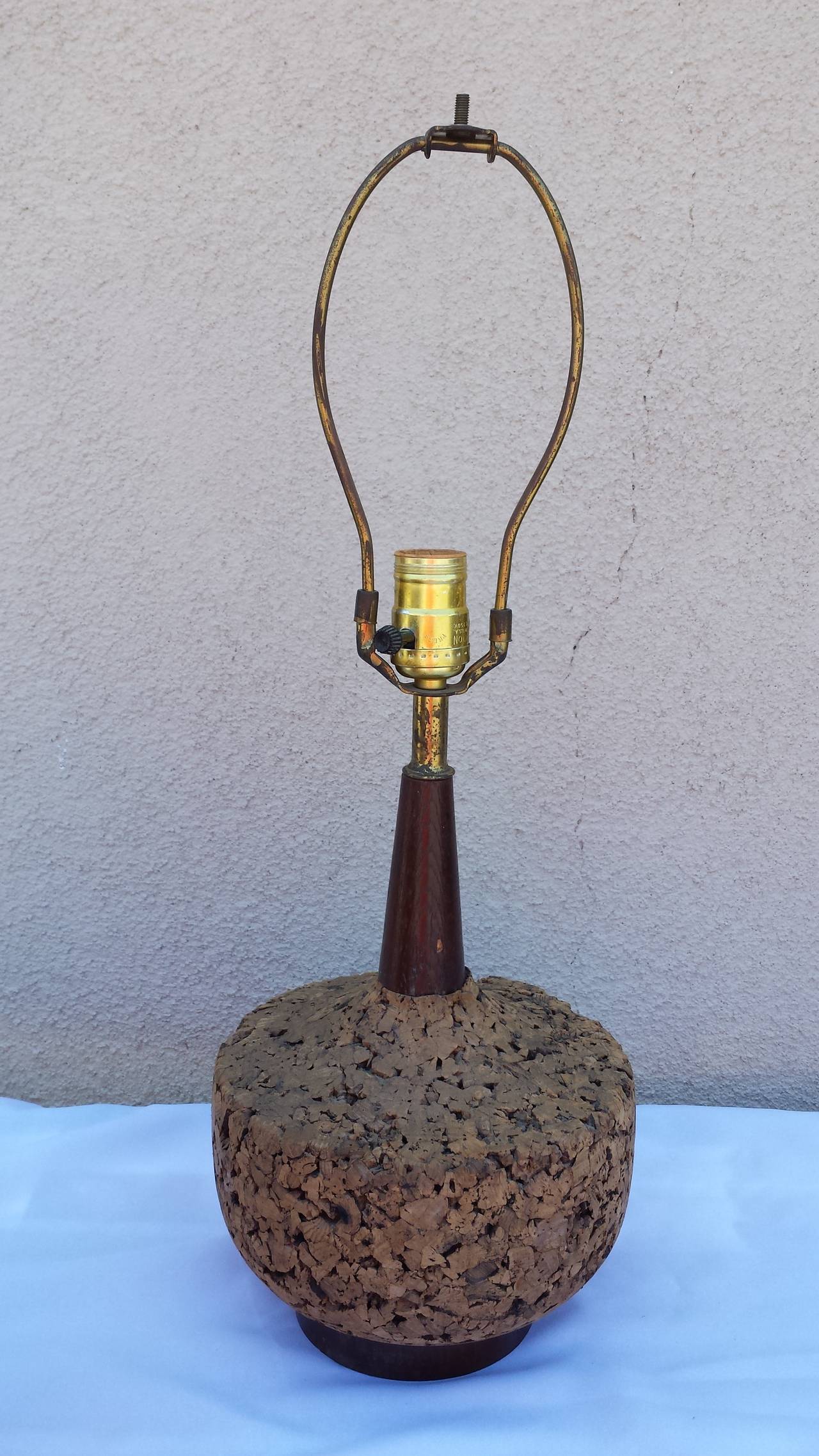Cork lamp. Comes with original shade. Total measures with shade  11x23.