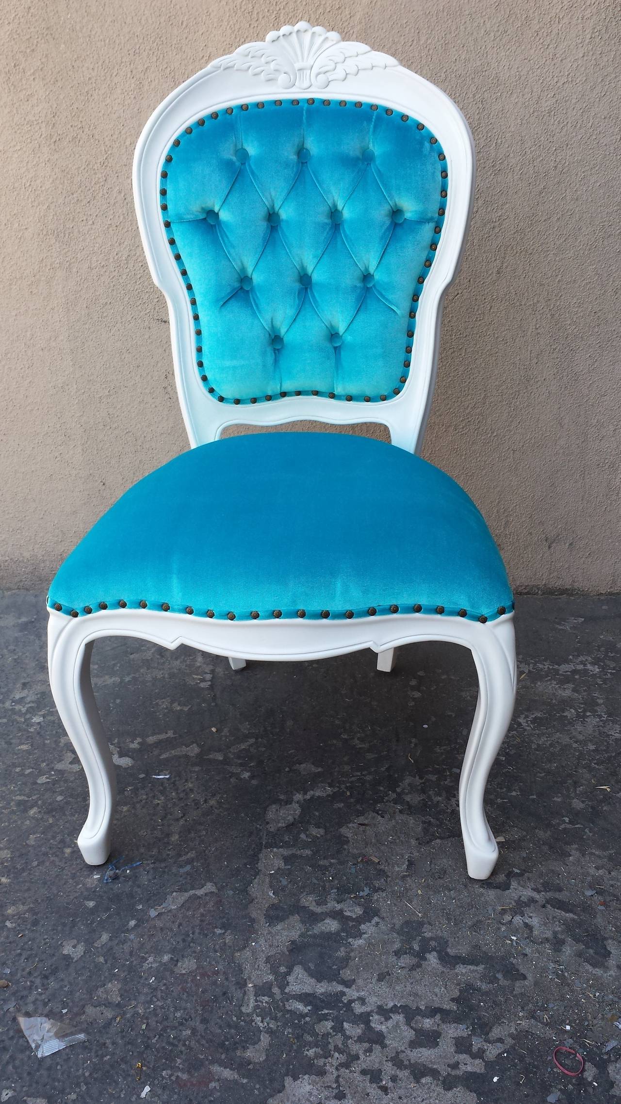 Set of 6 Chairs in the French Louis XV style. Newly painted in glossy white finish. Newly upholstered in Turquoise velvet blend fabric with nail heads trim.
