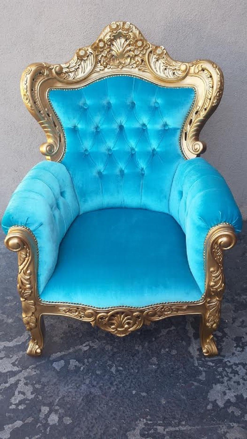 Pair of carved wooden armchairs in the French Louis XV armchairs. The wooden frame is newly painted in gold finish. The chairs have been newly upholstered in turquoise velvet blend fabric and deep tufted on the back.

Dimension: W32