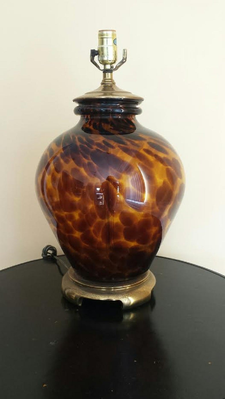 Beautiful Mid Century style Table Lamp. Amber Glass with Leopard Pattern design. The blown glass is very thick and the lamp is heavy comes with brass ball finial. Some rust spots to the brass.