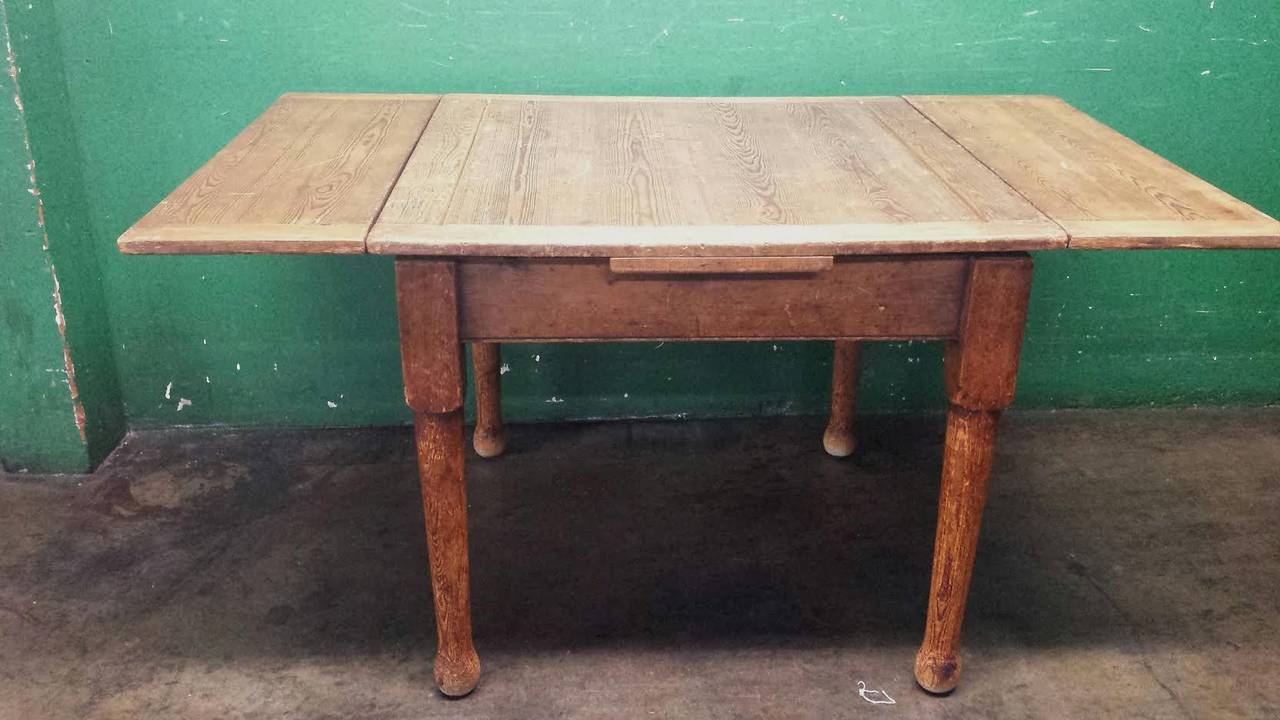 Beautiful Farm House Table. Pine Wood in original condition. Comes with two leaves on the sides. Table Dimension with Leaves 59