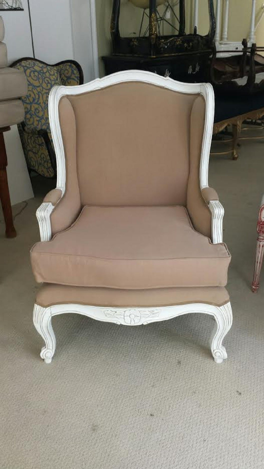 Beautiful Pair of Armchairs in the French Louis XV style. White distressed wooden frame. Upholstered in Cotton in Taupe color with trim.