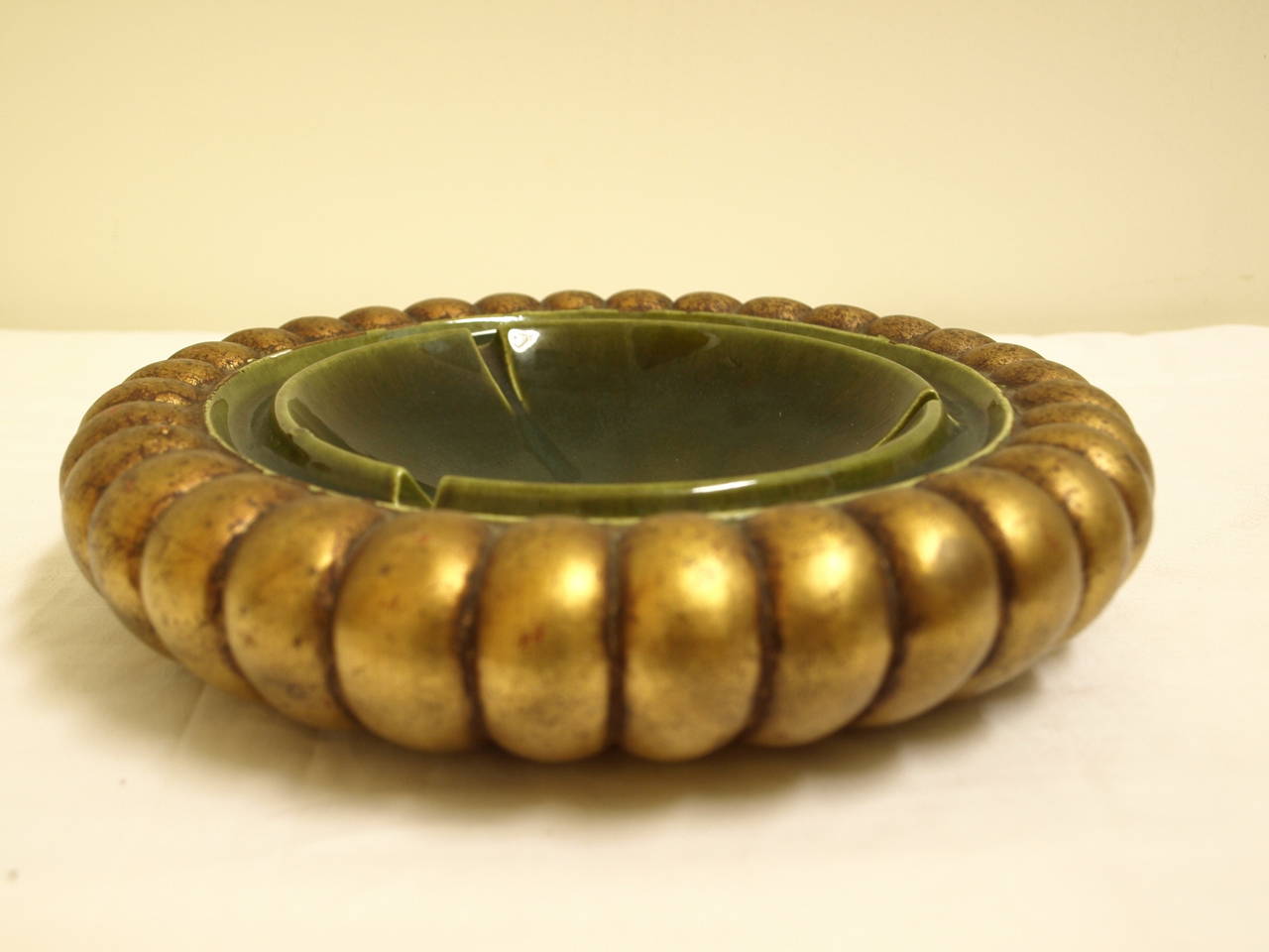 Amazing large mid century ashtray. Signed by the artist and numbered. In gold leaf with patina shown.