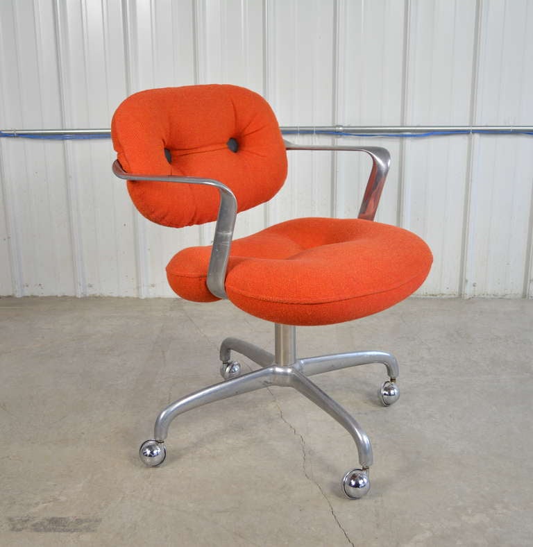 A pair of desk chairs designed by Morrison & Hannah for Knoll.  Sculpted aluminum frames.  Original Knoll upholstery.  Seat height is adjustable.  These chairs combine great design and comfort.  Labeled.