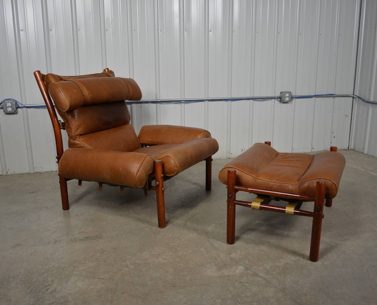An Inka lounge chair and ottoman designed by Arne Norell.  Beautiful leather cushions.  Solid beech frame.  
